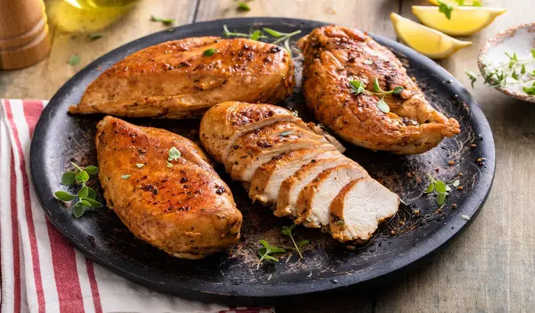 Juicy chicken breast cooked in airfryer on a serving plate