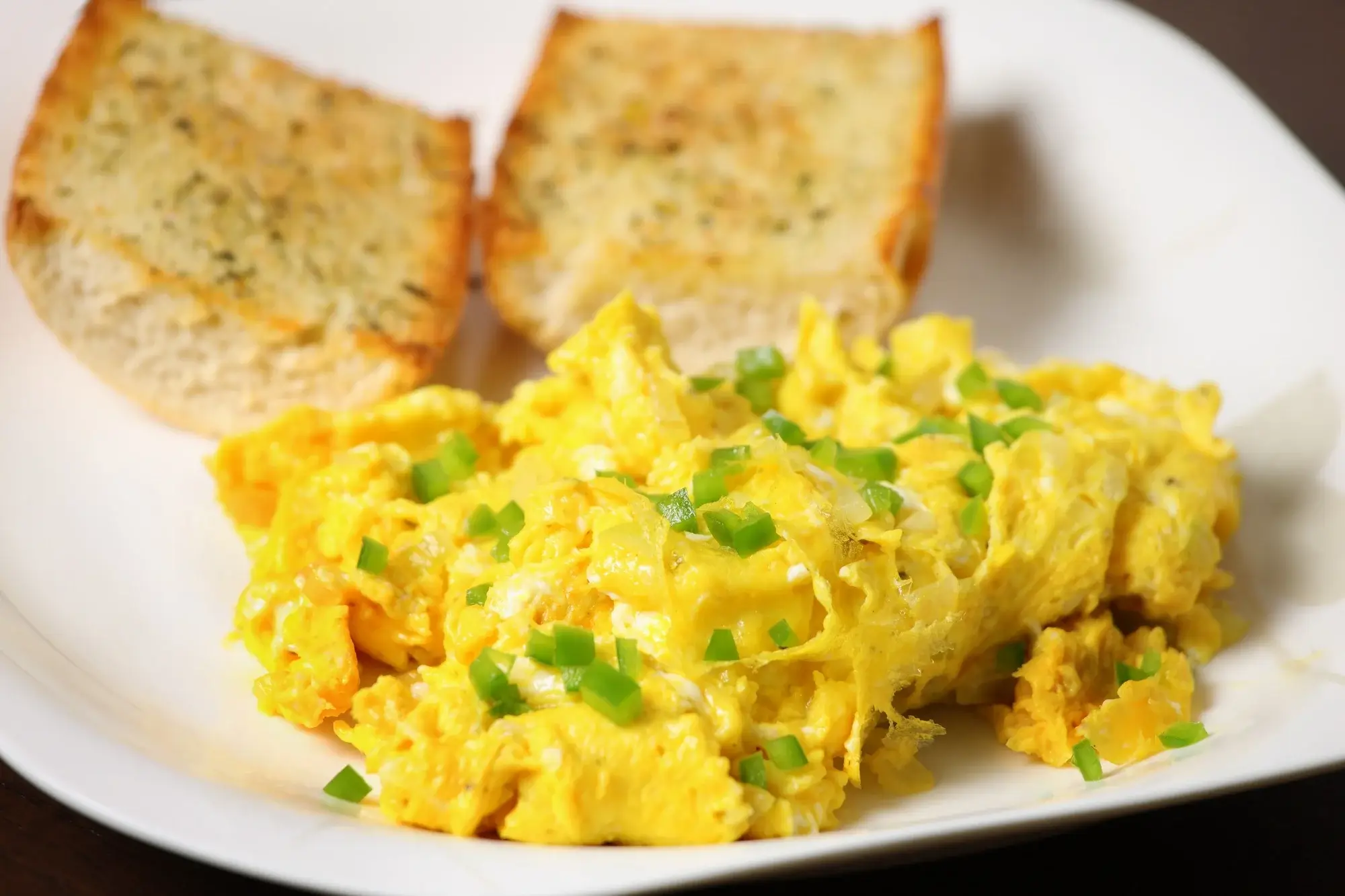 Scrambled eggs in air fryer served hot with toast