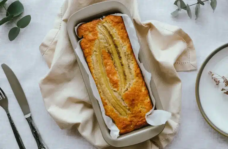 Banana cake in air fryer sliced and served on a plate