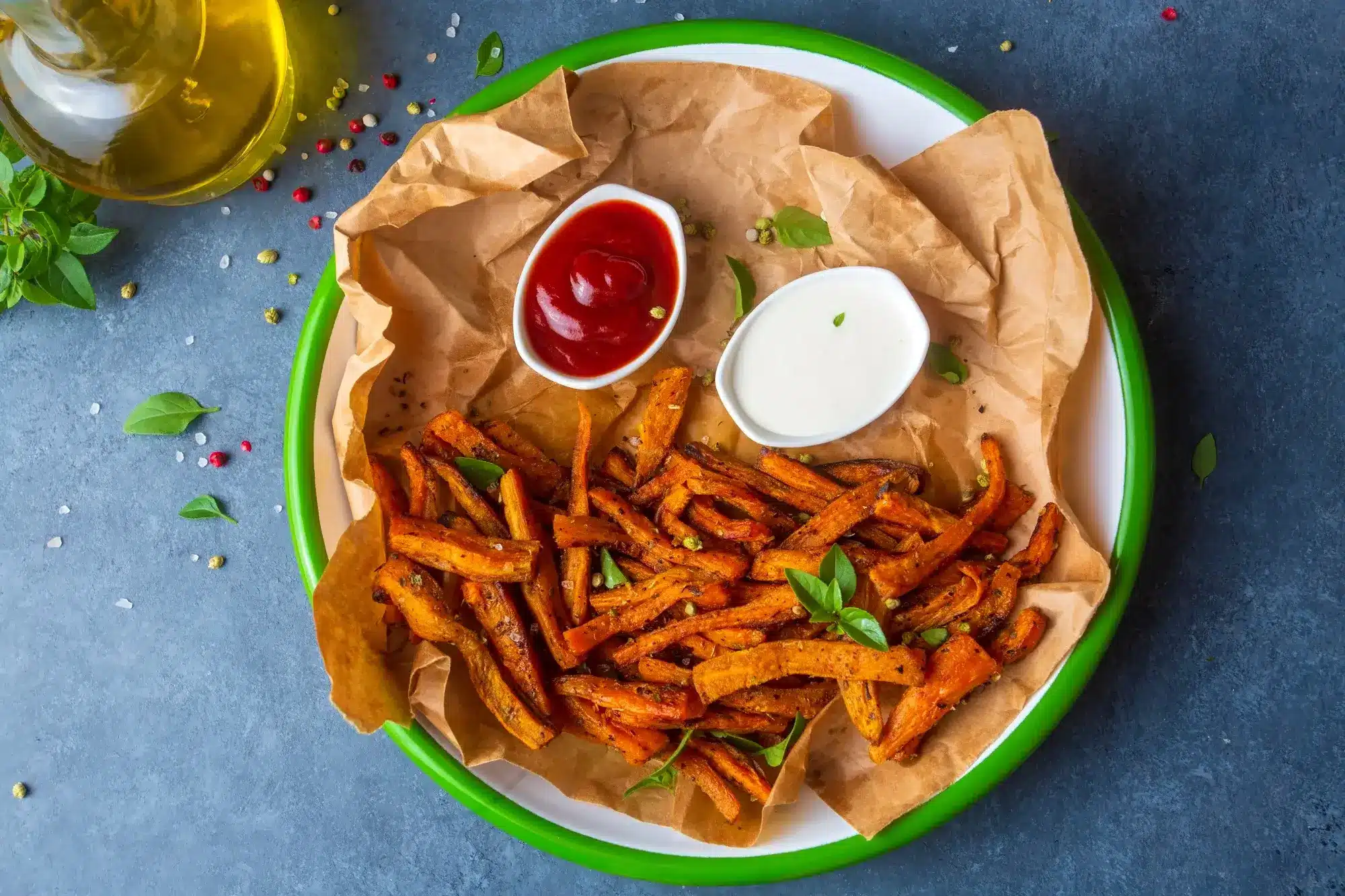 Crispy sweet potato fries in air fryer served with dip